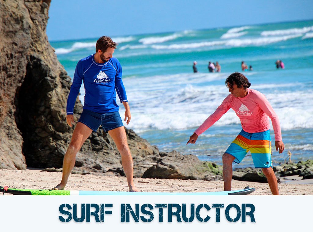 Surf instructor teaching on the beach in Mexico with WildMex.