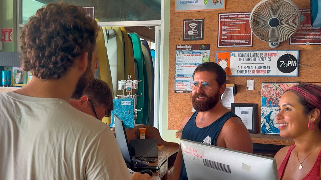 Front Desk Agent Job at Wildmex – Nayarit Mexico Two Wildmex front desk agents assisting guests at reception in Sayulita Mexico